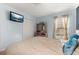 Bedroom with light blue walls, a comfortable bed, and ample storage at 501 Pheasant Dr, Haines City, FL 33844