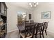 Traditional dining room with a dark wood table set, light gray walls, and a chandelier above at 501 Pheasant Dr, Haines City, FL 33844