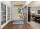 Inviting home foyer featuring wood floors and an open doorway to the front yard at 501 Pheasant Dr, Haines City, FL 33844