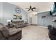 Cozy living room with plush seating, wall art, and a soaring vaulted ceiling at 501 Pheasant Dr, Haines City, FL 33844