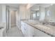 Bathroom vanity with granite countertops and dual sinks at 555 Viceroy Ct, Kissimmee, FL 34758