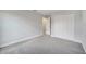 Carpeted bedroom with double door closet and a large window overlooking the backyard at 555 Viceroy Ct, Kissimmee, FL 34758