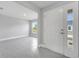 Open foyer with tile floors leading to an airy living space with bright, natural light at 555 Viceroy Ct, Kissimmee, FL 34758