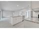 Bright kitchen features a central island with granite countertops and stainless steel appliances at 555 Viceroy Ct, Kissimmee, FL 34758