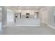 Modern kitchen with white cabinets, stainless steel appliances, and a large island for meal prep and dining at 555 Viceroy Ct, Kissimmee, FL 34758