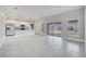 Spacious living room boasts ceramic tile flooring, abundant natural light, and a sliding glass door to the backyard at 555 Viceroy Ct, Kissimmee, FL 34758