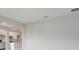 An open floor plan displays the kitchen with white cabinets, granite counters, and stainless steel appliances at 555 Viceroy Ct, Kissimmee, FL 34758