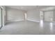 Spacious living area features tiled floors and a view of the foyer and doorways at 555 Viceroy Ct, Kissimmee, FL 34758