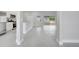 Open-concept living space showcasing modern tile floors and lots of natural light at 555 Viceroy Ct, Kissimmee, FL 34758