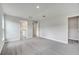 Open main bedroom featuring plush carpeting, a walk-in closet, and an en suite bathroom at 555 Viceroy Ct, Kissimmee, FL 34758