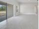 Open concept floor plan with sliding glass door to patio at 555 Viceroy Ct, Kissimmee, FL 34758