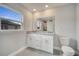 Bathroom with granite countertops, a window, and tile floors is spacious and well-lit at 557 Viceroy Ct, Kissimmee, FL 34758