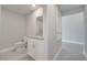 Compact powder room with granite sink and tile floors is conveniently located off of the hallway at 557 Viceroy Ct, Kissimmee, FL 34758