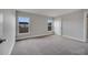 Spacious bedroom with carpet flooring and two windows offering outdoor views at 557 Viceroy Ct, Kissimmee, FL 34758