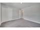 Spacious bedroom featuring carpeted floors, closet, neutral walls, and a bright window at 557 Viceroy Ct, Kissimmee, FL 34758