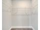 Walk-in closet with carpet flooring and white wire shelving at 557 Viceroy Ct, Kissimmee, FL 34758