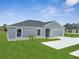 Well-maintained single-story home with a manicured lawn and a driveway at 557 Viceroy Ct, Kissimmee, FL 34758