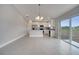 Modern kitchen with white cabinets, stainless steel appliances, and granite countertops at 557 Viceroy Ct, Kissimmee, FL 34758