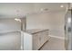 Bright kitchen island with granite countertops, stainless steel appliances, and gray tile floors at 557 Viceroy Ct, Kissimmee, FL 34758