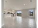 Open-concept living room and kitchen with tile flooring and stainless steel appliances at 557 Viceroy Ct, Kissimmee, FL 34758