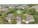 Aerial view of community center and pool with lush landscaping at 6548 Swissco Dr # 61, Orlando, FL 32822