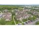 Aerial view of condominiums with mature trees, landscaping, and parking at 6548 Swissco Dr # 61, Orlando, FL 32822
