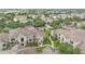 Aerial view of condominium community featuring manicured green spaces and mature trees at 6548 Swissco Dr # 61, Orlando, FL 32822