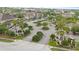Aerial view of a community entrance with manicured landscaping and multi-Gathering residences at 6548 Swissco Dr # 61, Orlando, FL 32822