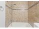 Close up of bathtub and tile surround with shower fixture in bathroom at 6548 Swissco Dr # 61, Orlando, FL 32822