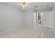 Neutral bedroom featuring tile flooring and an en suite bathroom at 6548 Swissco Dr # 61, Orlando, FL 32822