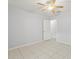 Light-filled bedroom showcasing neutral walls and ceramic tile flooring at 6548 Swissco Dr # 61, Orlando, FL 32822