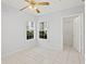 Light bedroom featuring tile floors, natural light and a walk-in closet at 6548 Swissco Dr # 61, Orlando, FL 32822
