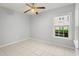 Bedroom with tile floors, a ceiling fan, and a window with blinds at 6548 Swissco Dr # 61, Orlando, FL 32822