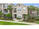 Inviting two-story townhouse with a charming balcony and well-manicured landscaping at 6548 Swissco Dr # 61, Orlando, FL 32822