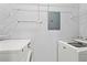 Laundry room with washer, dryer, wire shelving, and utility panel at 6548 Swissco Dr # 61, Orlando, FL 32822