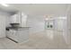 Open-concept kitchen and living room area featuring granite counters and tile flooring at 6548 Swissco Dr # 61, Orlando, FL 32822