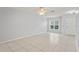 Large open-concept living space with tile flooring, ceiling fan and natural light at 6548 Swissco Dr # 61, Orlando, FL 32822