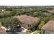 An aerial view of the townhome showcases its well maintained exterior, surrounded by mature landscaping and nearby community at 7521 Pellham Way, Kissimmee, FL 34747