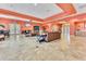 Spacious clubhouse with tile flooring, comfortable seating, and abundant natural light at 7521 Pellham Way, Kissimmee, FL 34747