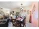 An open dining area features a stylish light fixture and tasteful decor at 7521 Pellham Way, Kissimmee, FL 34747