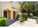 Inviting front entrance with potted plants and a charming doorway at 7521 Pellham Way, Kissimmee, FL 34747