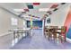Bright game room with a pool table, ping pong, and a cozy table for entertainment at 7521 Pellham Way, Kissimmee, FL 34747