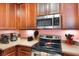 The kitchen is equipped with stainless steel appliances, and ample counter space at 7521 Pellham Way, Kissimmee, FL 34747
