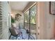 Screened-in lanai featuring seating, a rug, and a view of the outdoors at 7521 Pellham Way, Kissimmee, FL 34747