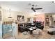 Inviting living room with comfortable seating, stylish decor, and bright natural light at 7521 Pellham Way, Kissimmee, FL 34747