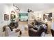 Stylish living area with unique wall decor, comfortable seating, and a cozy atmosphere at 7521 Pellham Way, Kissimmee, FL 34747
