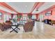 Inviting lounge area with comfortable seating, plants, and large windows for natural light at 7521 Pellham Way, Kissimmee, FL 34747