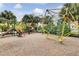 Fun community playground with slides, climbing structures, and a soft surface for to enjoy at 7521 Pellham Way, Kissimmee, FL 34747