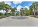 Fun splash pad with fountains, surrounded by palm trees, offering a playful outdoor experience at 7521 Pellham Way, Kissimmee, FL 34747
