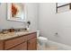 Bathroom featuring a granite countertop, wood vanity and a framed mirror at 781 Golden Bear Dr, Kissimmee, FL 34747